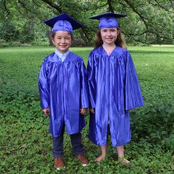 two kids with cap and gown